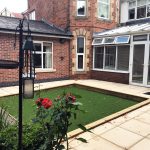 Conservatory opening into the back garden at The Limes